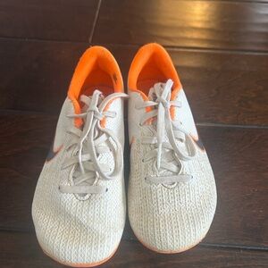 Kids White and Orange Athletic Nike cleats Shoes size 10 youth
